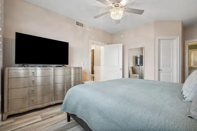 a spacious bathroom with a granite countertop sink mirror and