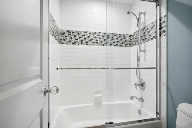 a view of a bathroom from the hallway