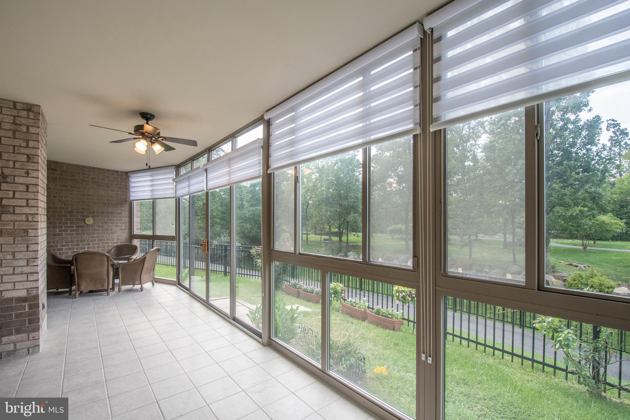 19365 Cypress Ridge Terrace, Unit 121 Leesburg, VA 20176 - Photo 1 of 31 Sunroom with custom blinds & leads to private yard