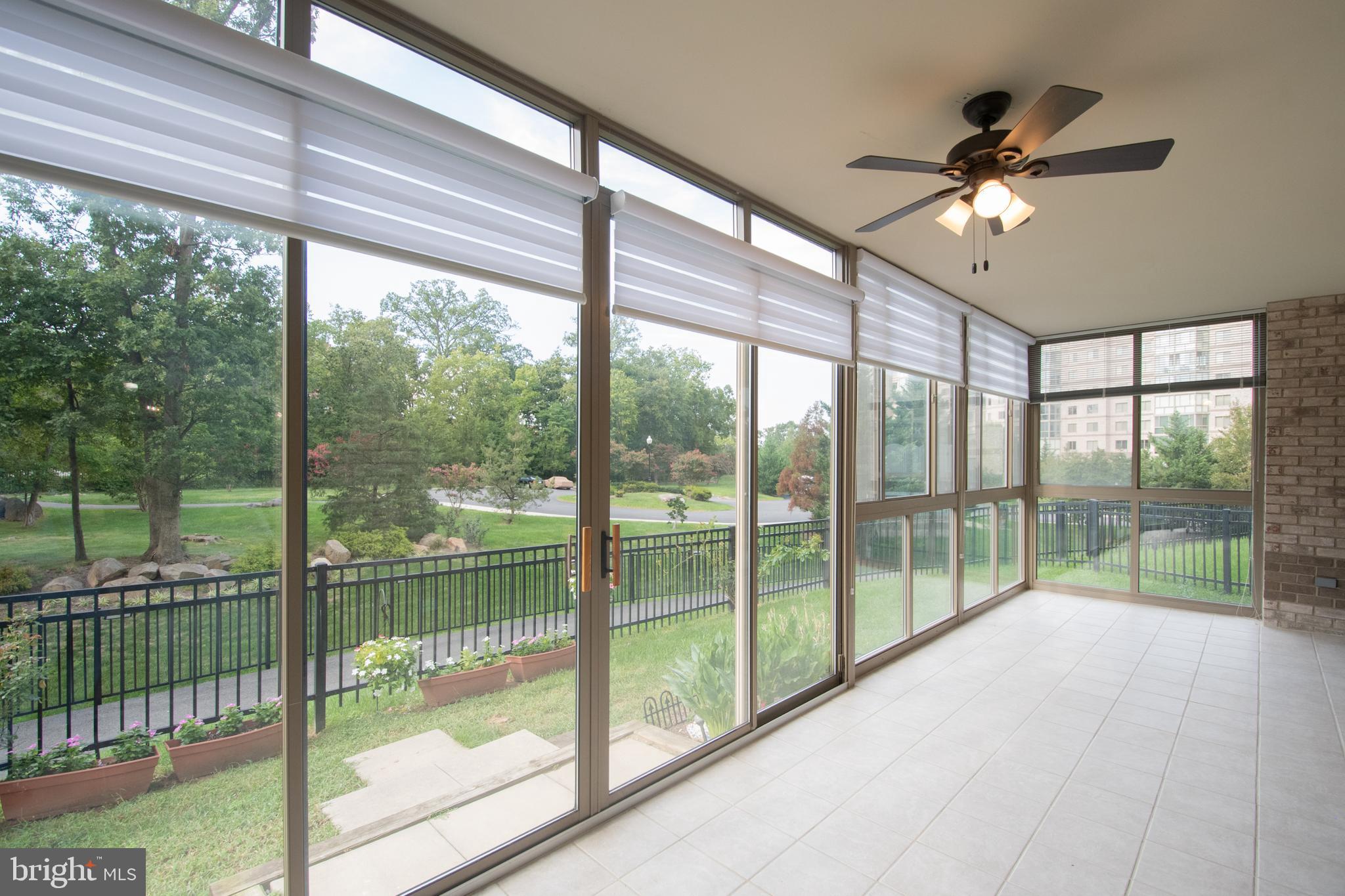 19365 Cypress Ridge Terrace, Unit 121 Leesburg, VA 20176 - Photo 2 of 31 Sunroom with custom blinds & leads to private yard