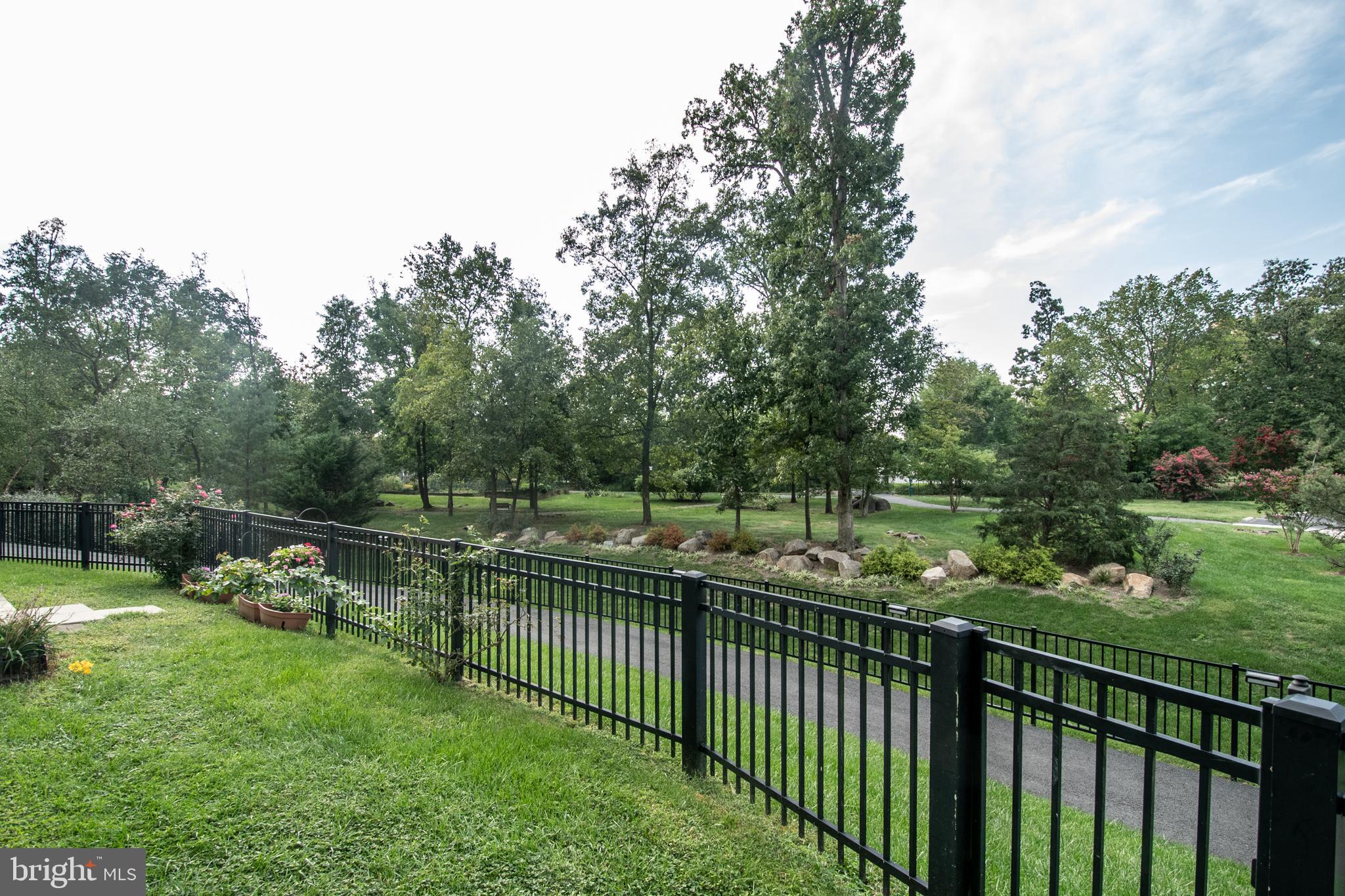 19365 Cypress Ridge Terrace, Unit 121 Leesburg, VA 20176 - Photo 3 of 31 Fenced yard maintained by the condo association