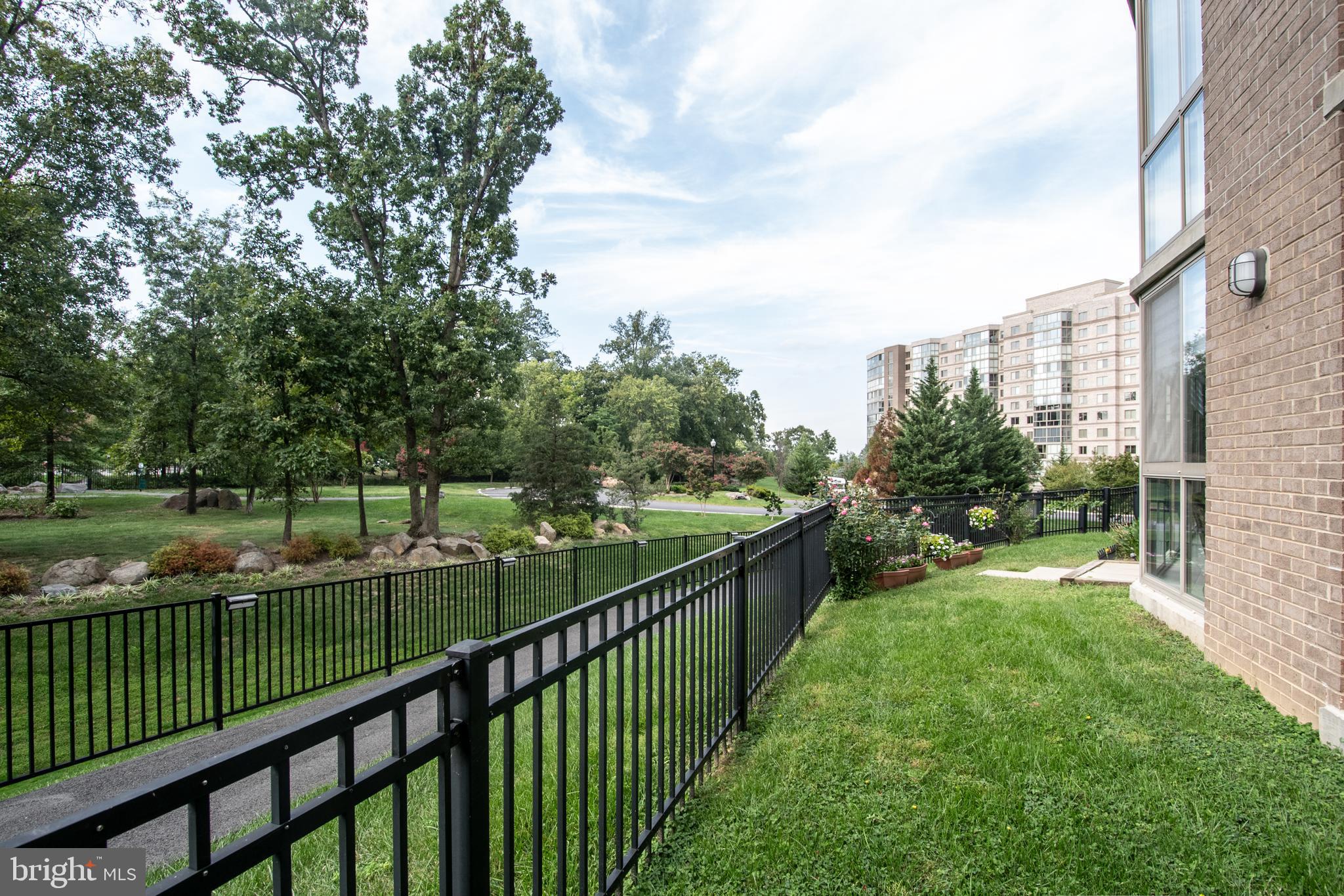 19365 Cypress Ridge Terrace, Unit 121 Leesburg, VA 20176 - Photo 4 of 31 Fenced yard maintained by the condo association