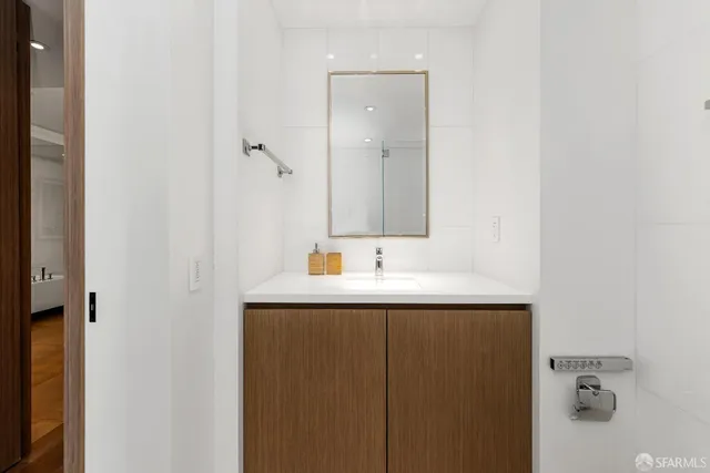 a bedroom with a bed and a lamp