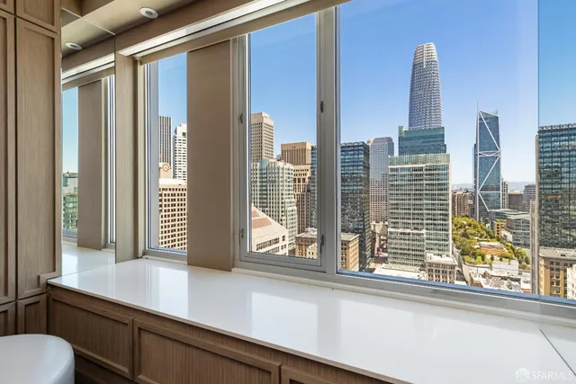 a spacious bathroom with a tub sink and mirror