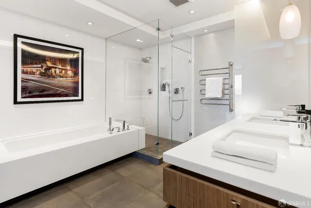 a bedroom with a large bed and a large window