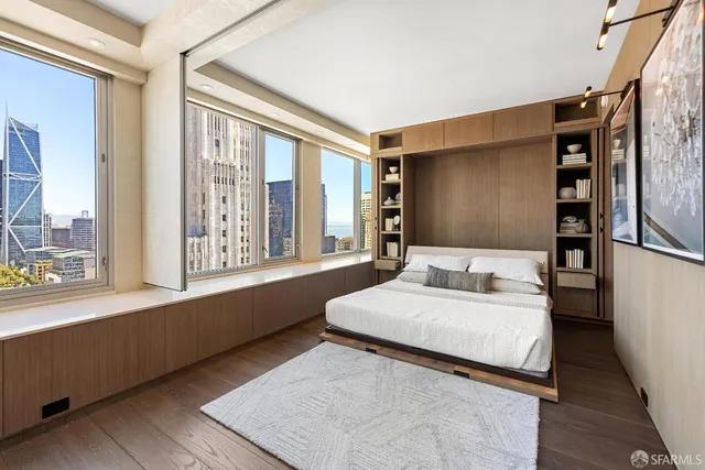 a bedroom with a large bed and a window