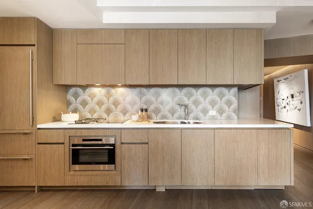 a view of a kitchen with microwave and cabinets