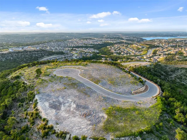 a view of a outdoor space with green field and trees