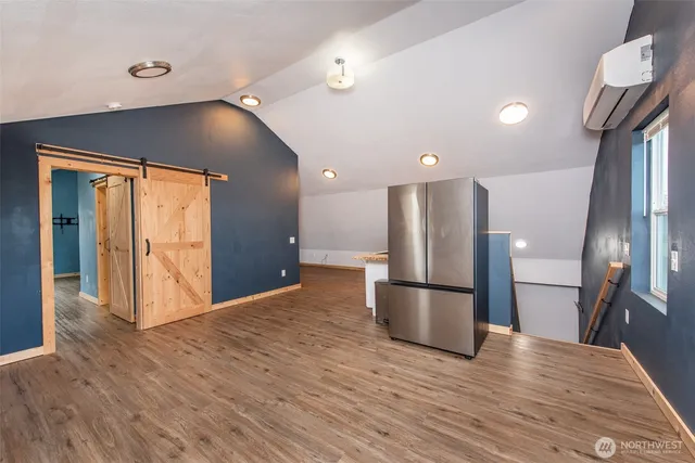 a view of a kitchen with a sink and a large window