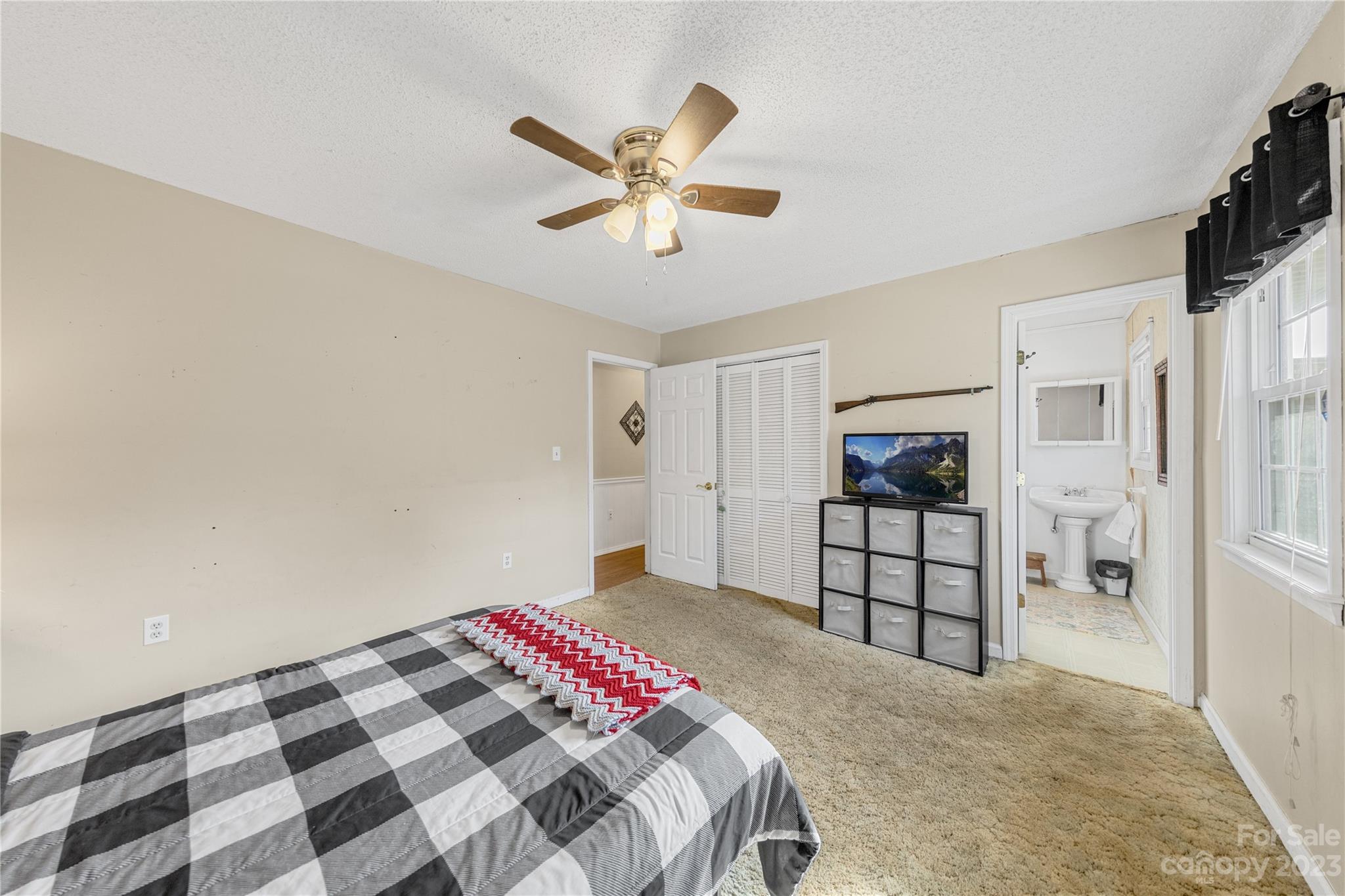 1260 State Rd S-46-536 Rock Hill, SC 29732 - Photo 13 of 34 a bedroom with a bed and a walk in closet with wooden floor