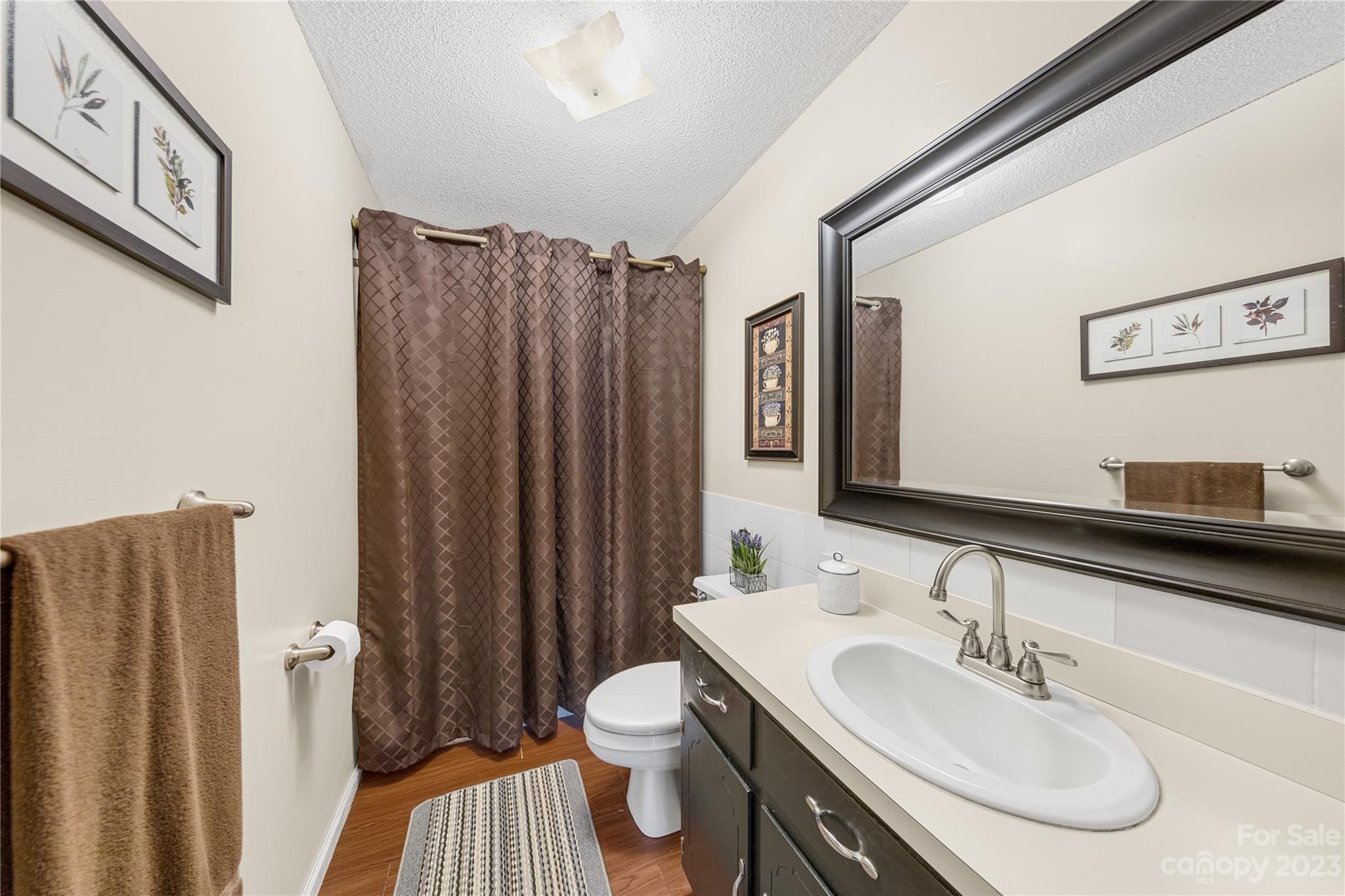 1260 State Rd S-46-536 Rock Hill, SC 29732 - Photo 24 of 34 a bathroom with a sink toilet and shower