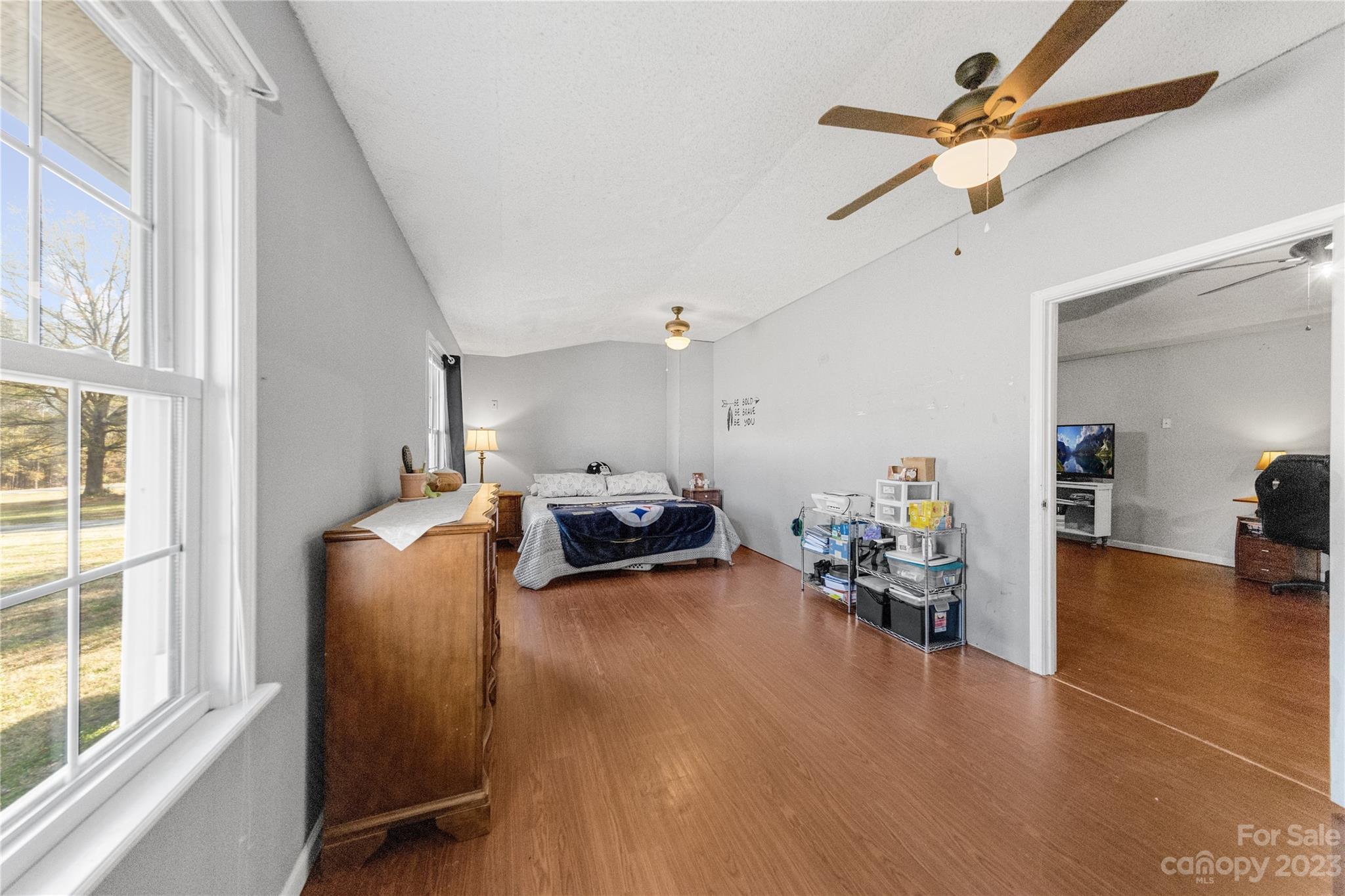 1260 State Rd S-46-536 Rock Hill, SC 29732 - Photo 31 of 34 a bedroom with furniture and a chandelier