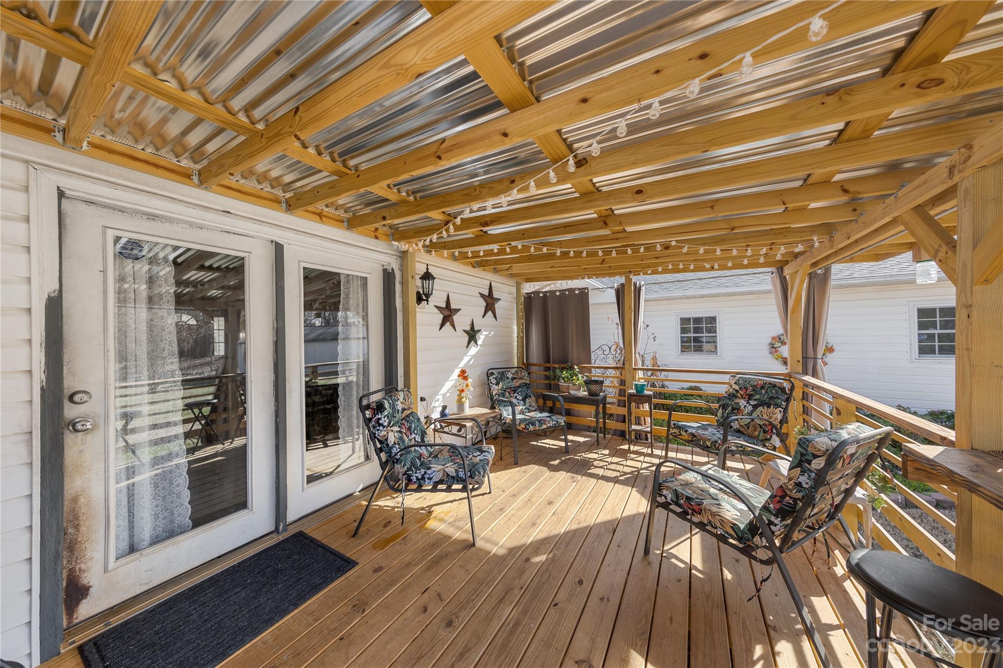 1260 State Rd S-46-536 Rock Hill, SC 29732 - Photo 6 of 34 a view of a patio with table and chairs with wooden floor