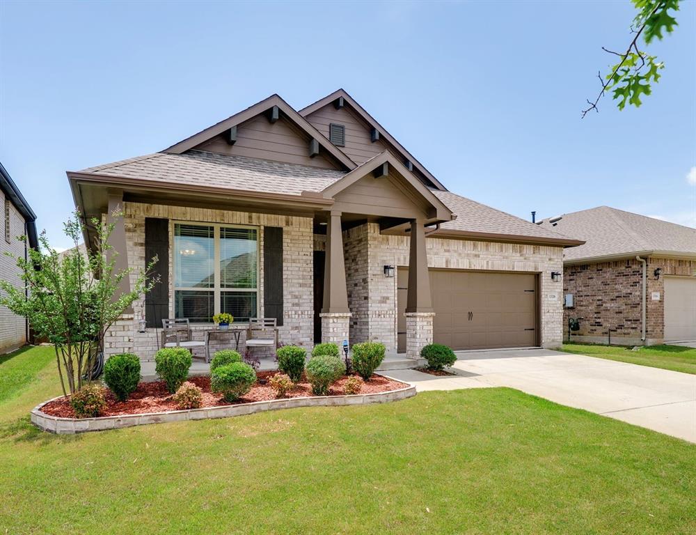 1320 Rosebush Road Aubrey, TX 76227 - Photo 1 of 33 a front view of a house with a yard and garage