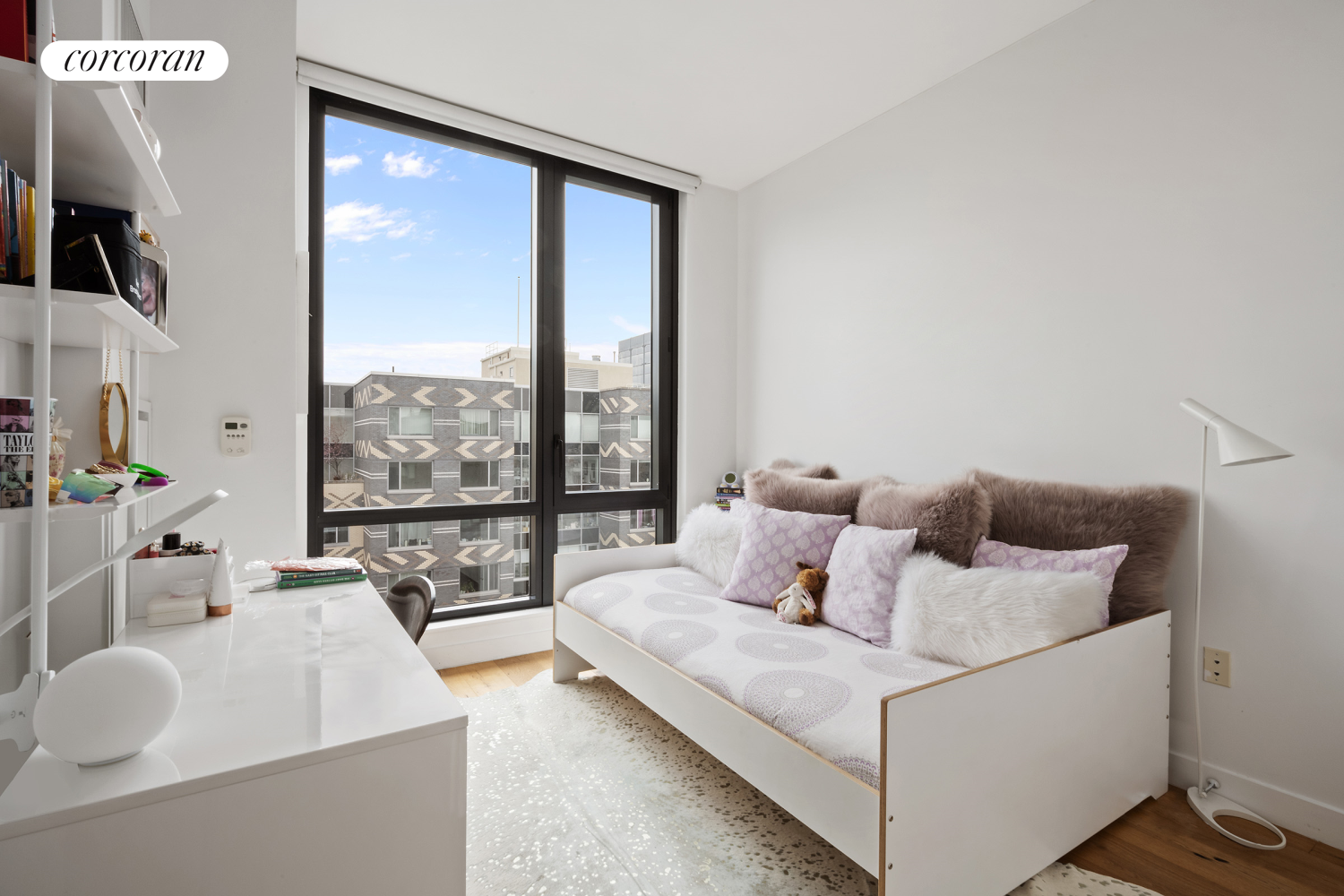 23 West 116th Street, Unit 12D Manhattan, NY 10026 - Photo 5 of 15 a living room with furniture and large windows