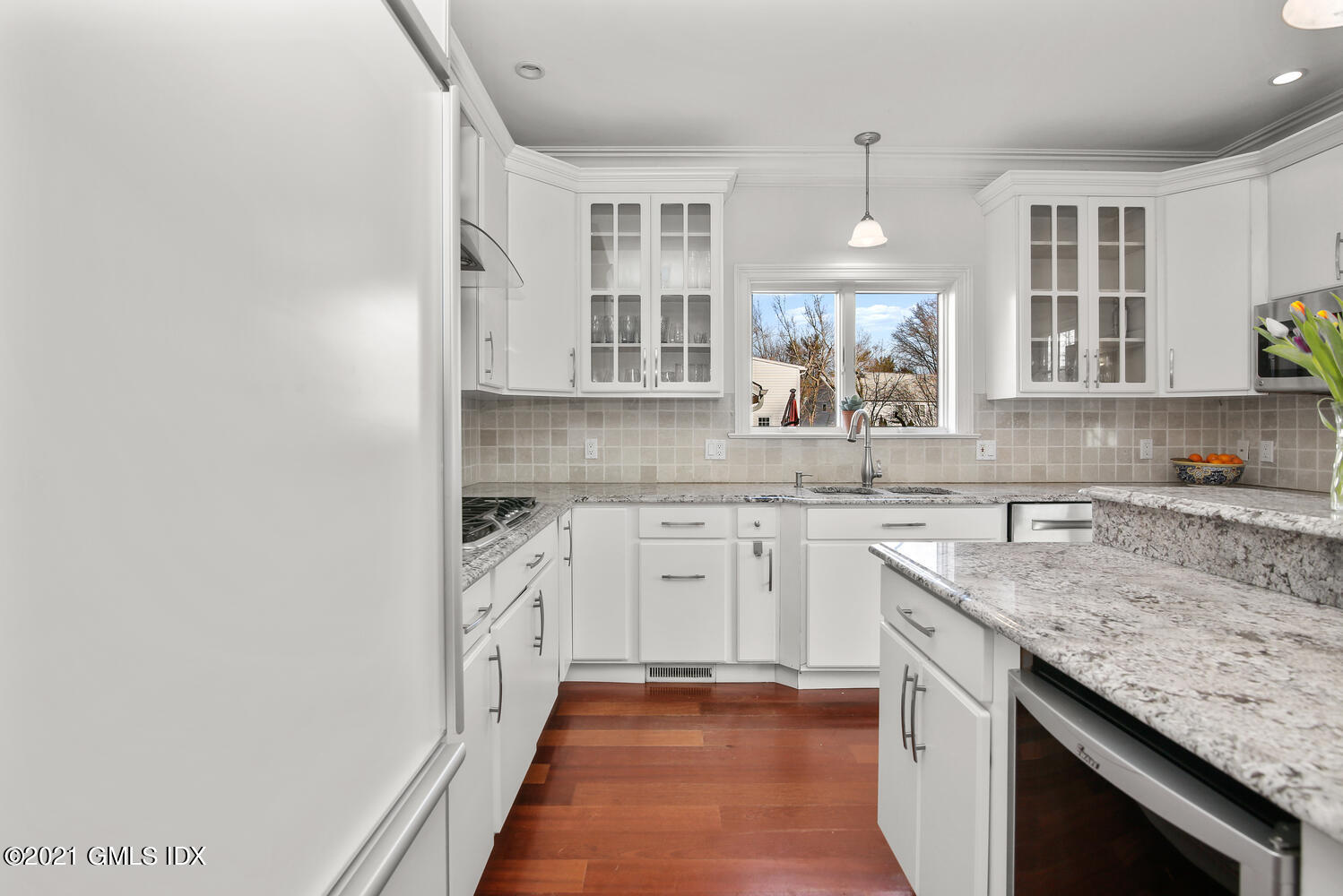 39 Lockwood Lane Riverside, CT 06878 - Photo 20 of 85 a kitchen with granite countertop cabinets stainless steel appliances a sink and a window