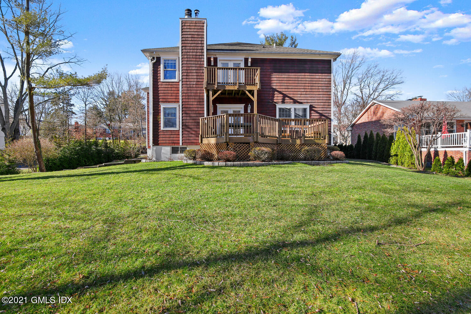 39 Lockwood Lane Riverside, CT 06878 - Photo 68 of 85 a view of a house with a big yard and large trees