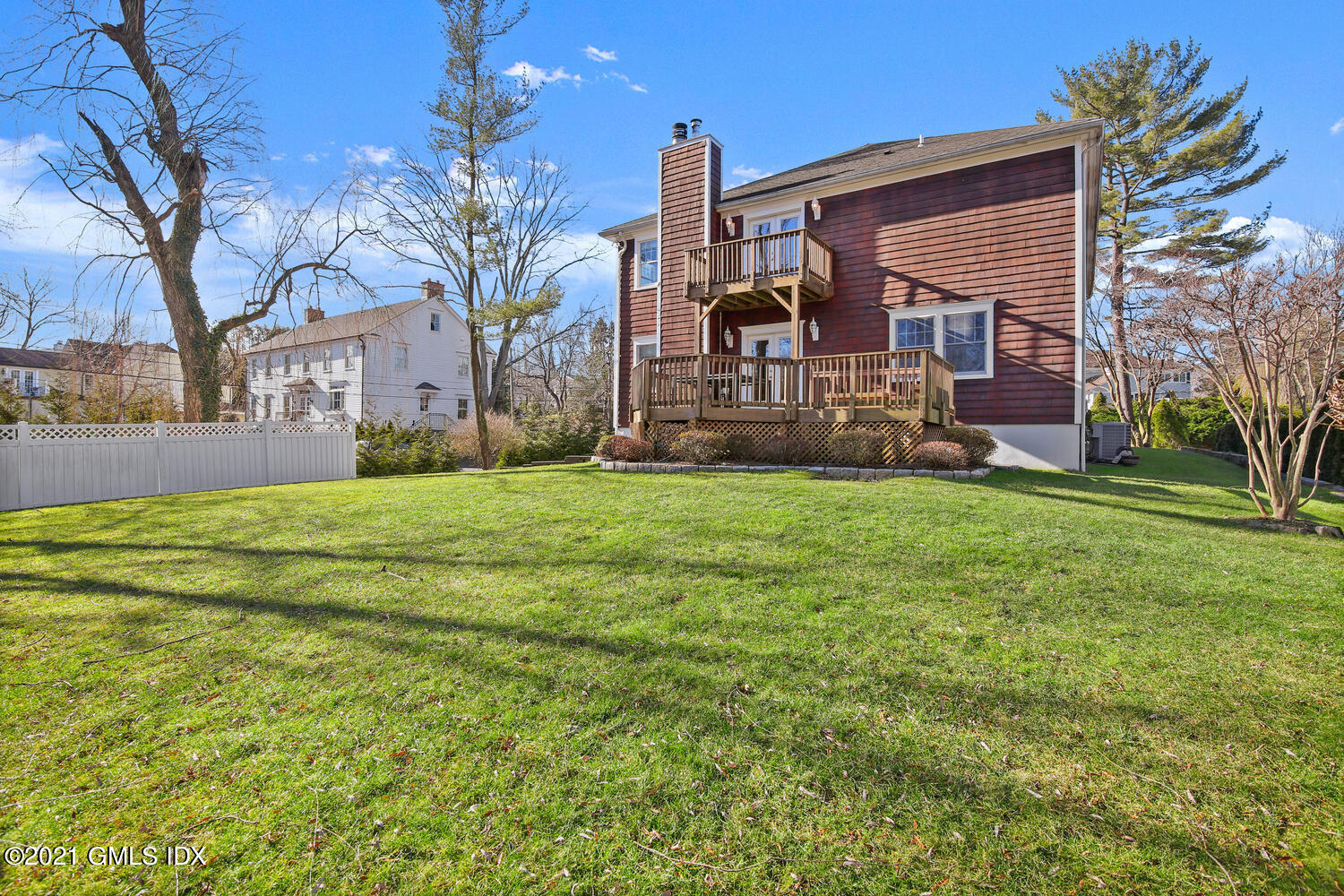 39 Lockwood Lane Riverside, CT 06878 - Photo 69 of 85 a view of a house with a big yard and large trees