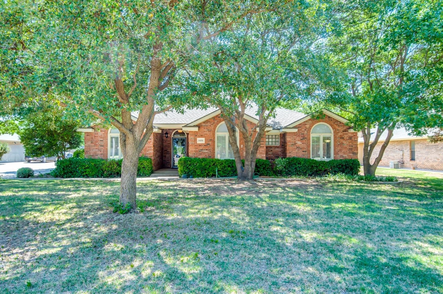 8404 Rochester Avenue Lubbock, TX 79424 - Photo 2 of 10 a front view of a house with a yard