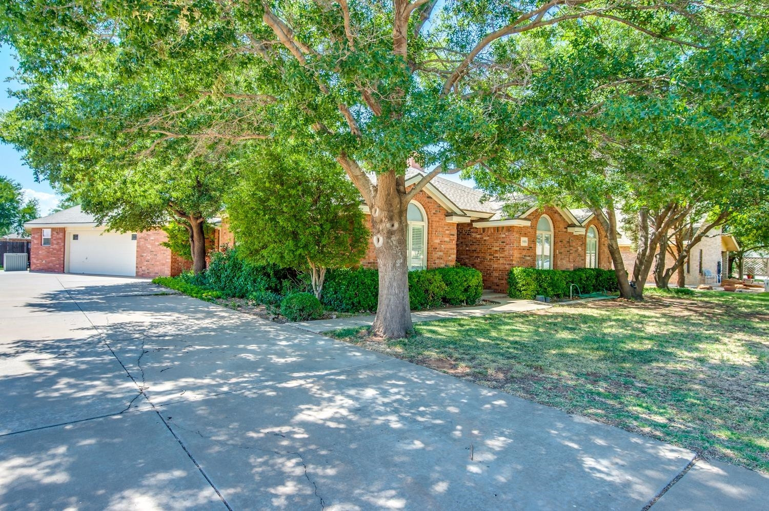 8404 Rochester Avenue Lubbock, TX 79424 - Photo 3 of 10 a view of a house with a yard