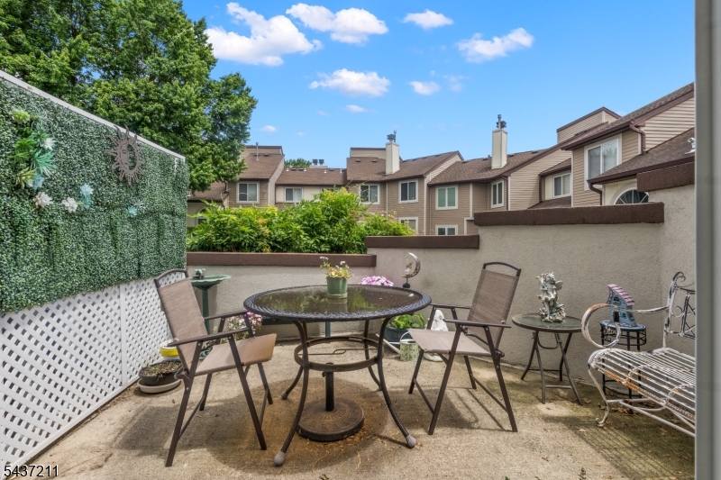 3701 Park Place Springfield, NJ 07081 - Photo 29 of 38 a view of a patio with table and chairs and potted plants