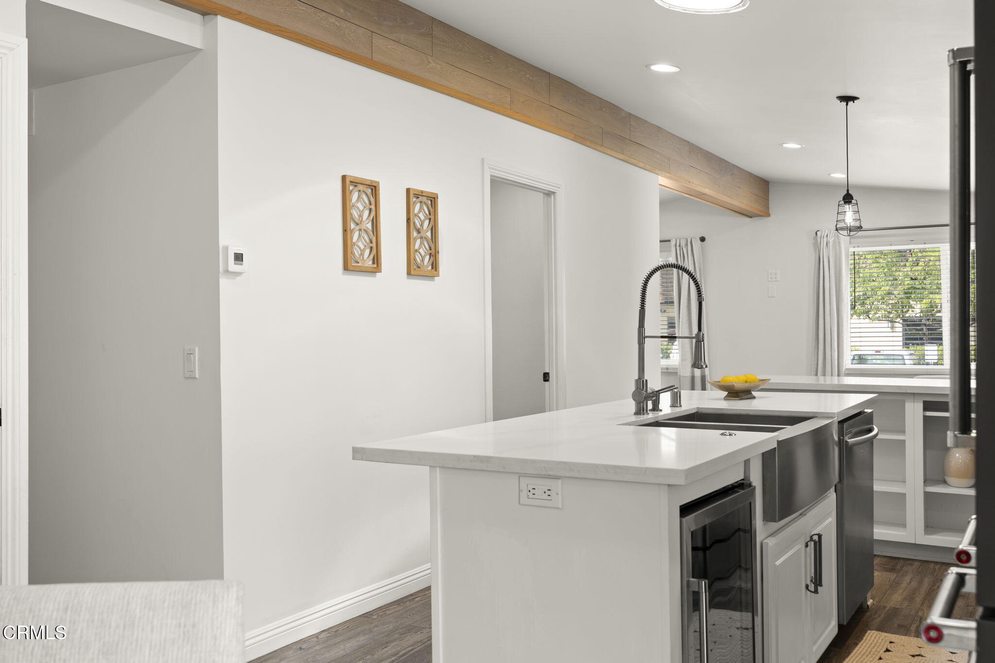 2472 Apple Lane, Unit 170 Oxnard, CA 93036 - Photo 12 of 47 a kitchen with stainless steel appliances a sink and a stove with wooden floor