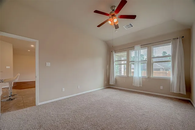 a view of an empty room with a window