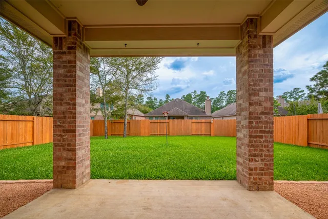 a view of a porch with a yard