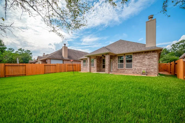 a backyard of a house with lots of green space