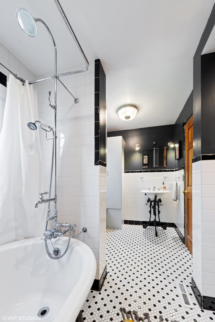 401 Lyon Avenue Wheaton, IL 60187 - Photo 11 of 34 a bathroom with a sink a toilet and shower