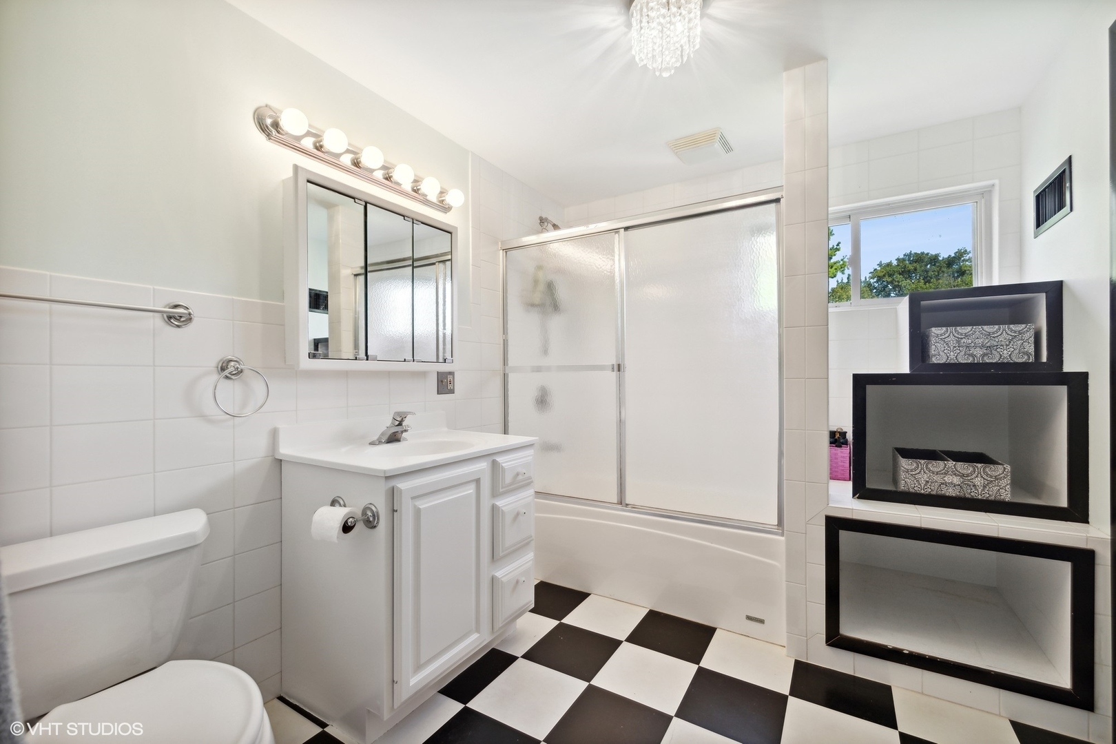 401 Lyon Avenue Wheaton, IL 60187 - Photo 12 of 34 a bathroom with a sink toilet a mirror and shower