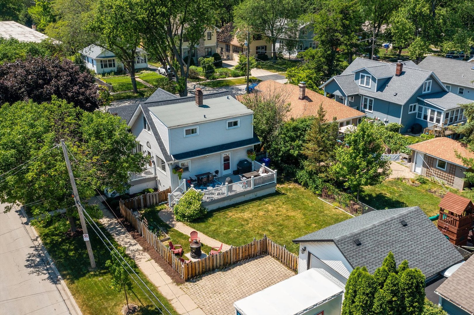 401 Lyon Avenue Wheaton, IL 60187 - Photo 20 of 34 an aerial view of a house with swimming pool and a yard