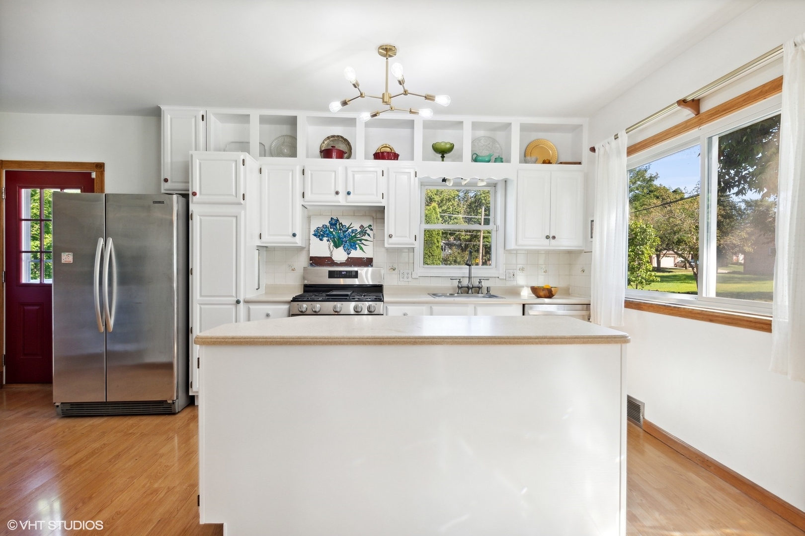 401 Lyon Avenue Wheaton, IL 60187 - Photo 2 of 34 a kitchen with stainless steel appliances granite countertop a refrigerator and a sink