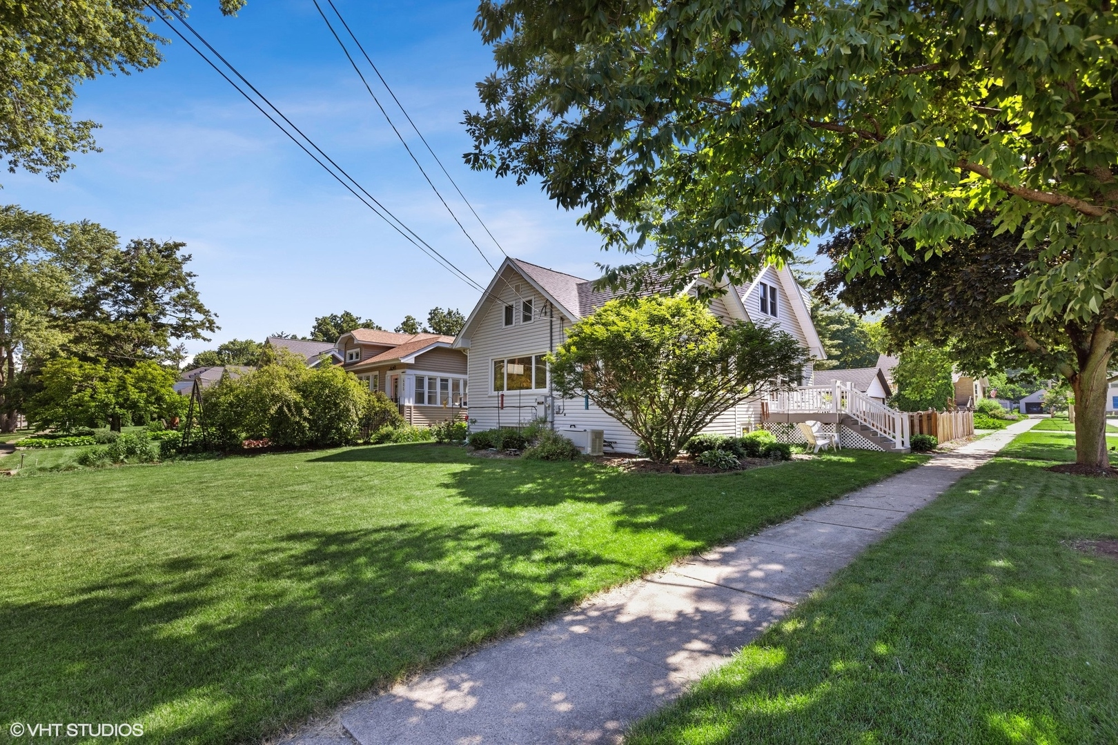 401 Lyon Avenue Wheaton, IL 60187 - Photo 23 of 34 a view of a house with a big yard potted plants and large tree