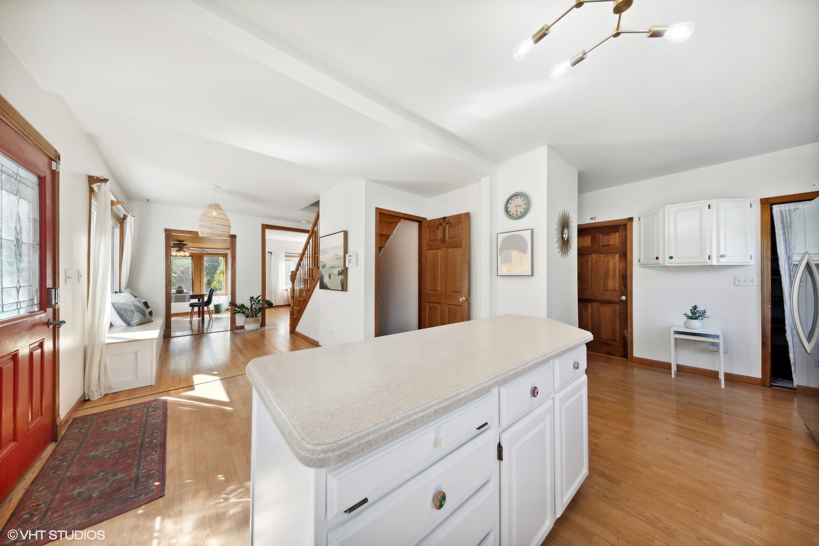 401 Lyon Avenue Wheaton, IL 60187 - Photo 4 of 34 a living room with stainless steel appliances kitchen island furniture and wooden floor