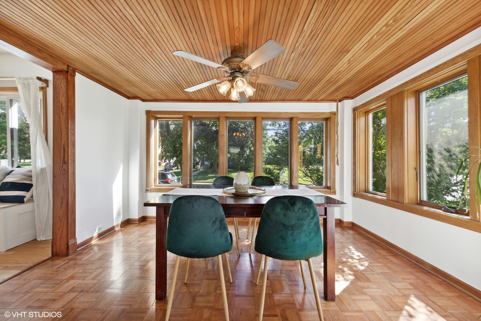401 Lyon Avenue Wheaton, IL 60187 - Photo 8 of 34 a view of a dining room with furniture large windows and wooden floor
