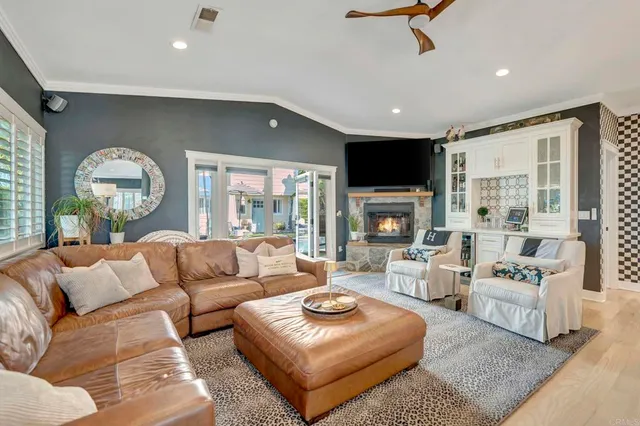 a bathroom with a sink a mirror a toilet and shower