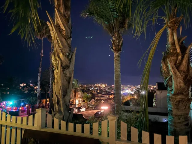 a living room with fireplace furniture and a flat screen tv
