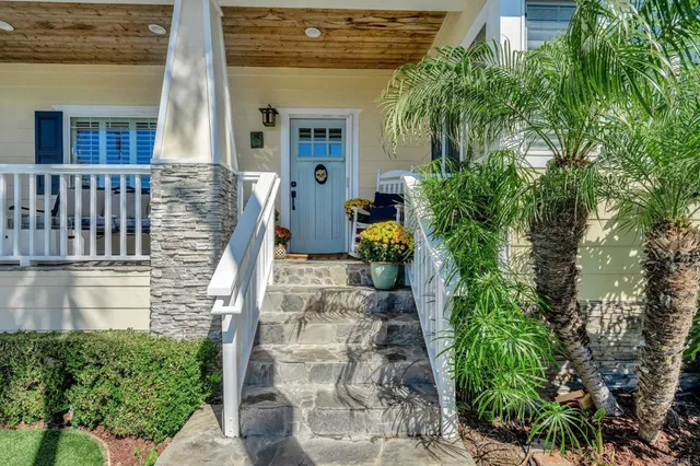 a living room with fireplace furniture and a flat screen tv