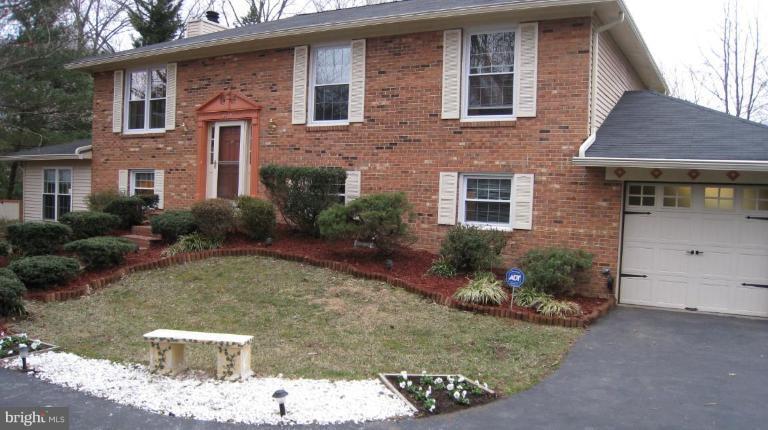 8532 Riverside Road Alexandria, VA 22308 - Photo 2 of 22 a front view of a house with garden