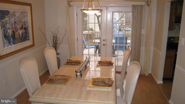 8532 Riverside Road Alexandria, VA 22308 - Photo 3 of 22 a room with furniture and a chandelier