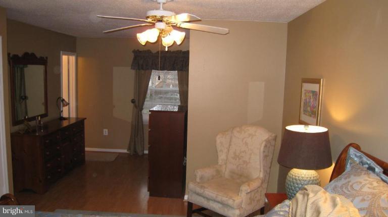 8532 Riverside Road Alexandria, VA 22308 - Photo 5 of 22 a view of hall way with mirror and furniture