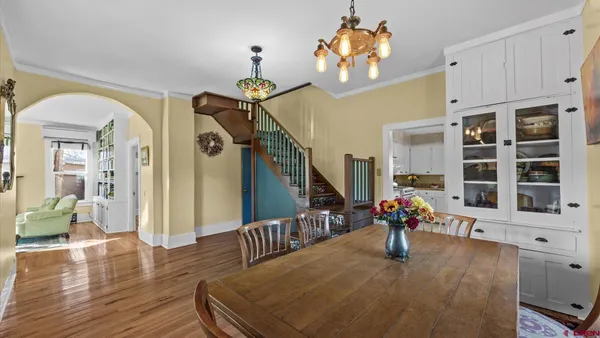 a view of a dining room with furniture window and wooden floor