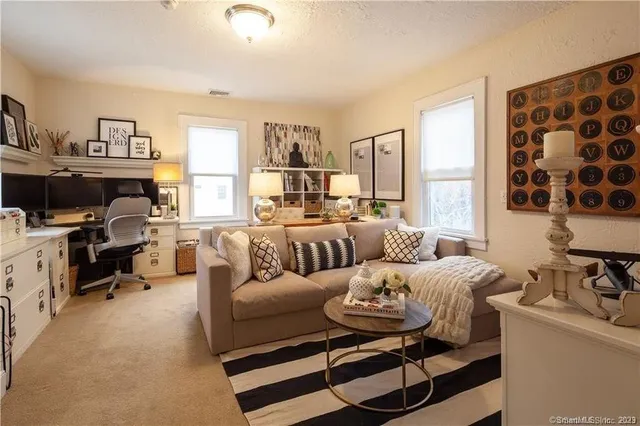 a living room with furniture and a window
