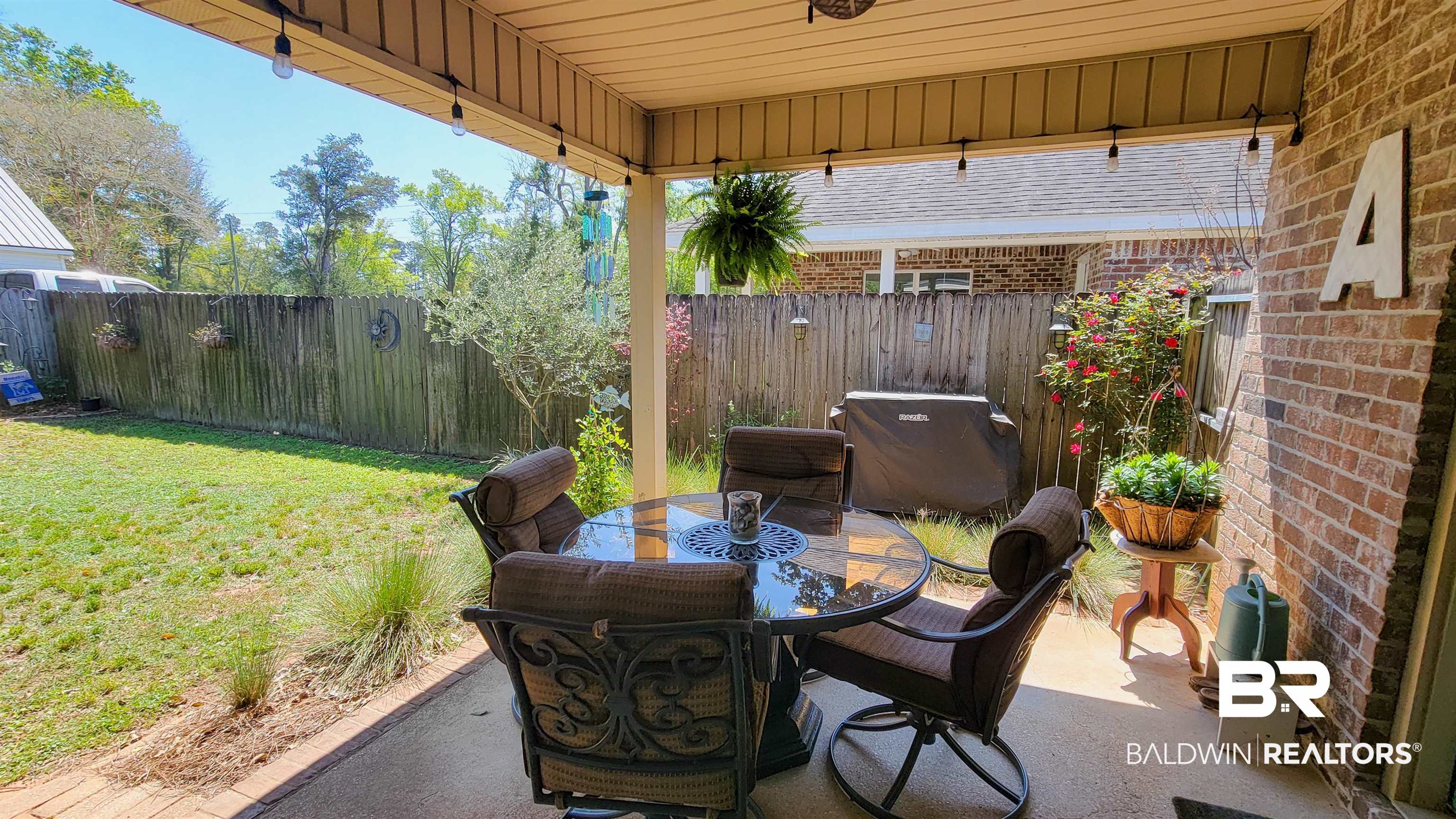 1304 Majesty Loop Foley, AL 36535 - Photo 25 of 44 Fenced backyard featuring a patio area, area for grilling, and outdoor dining space