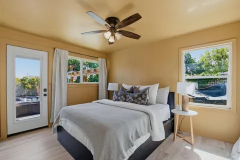 a bedroom with a large bed and a window