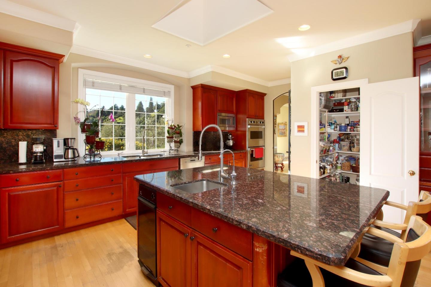 344 Los Robles Road Soquel, CA 95073 - Photo 17 of 76 a kitchen with stainless steel appliances granite countertop a sink table and chairs