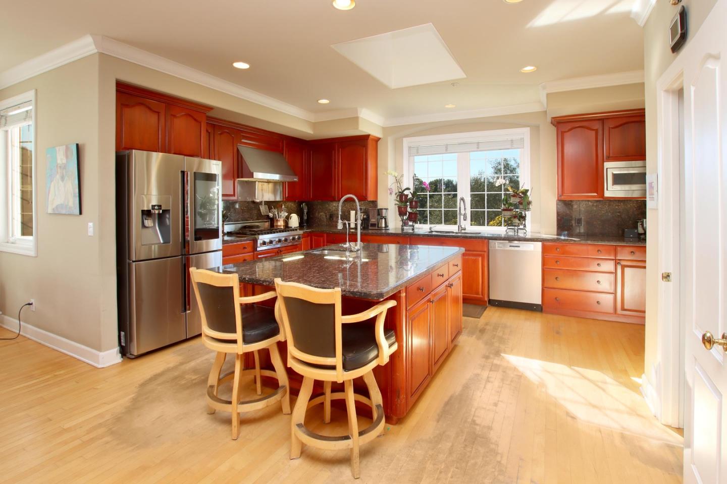 344 Los Robles Road Soquel, CA 95073 - Photo 22 of 76 a dining room with stainless steel appliances a dining table chairs and large windows
