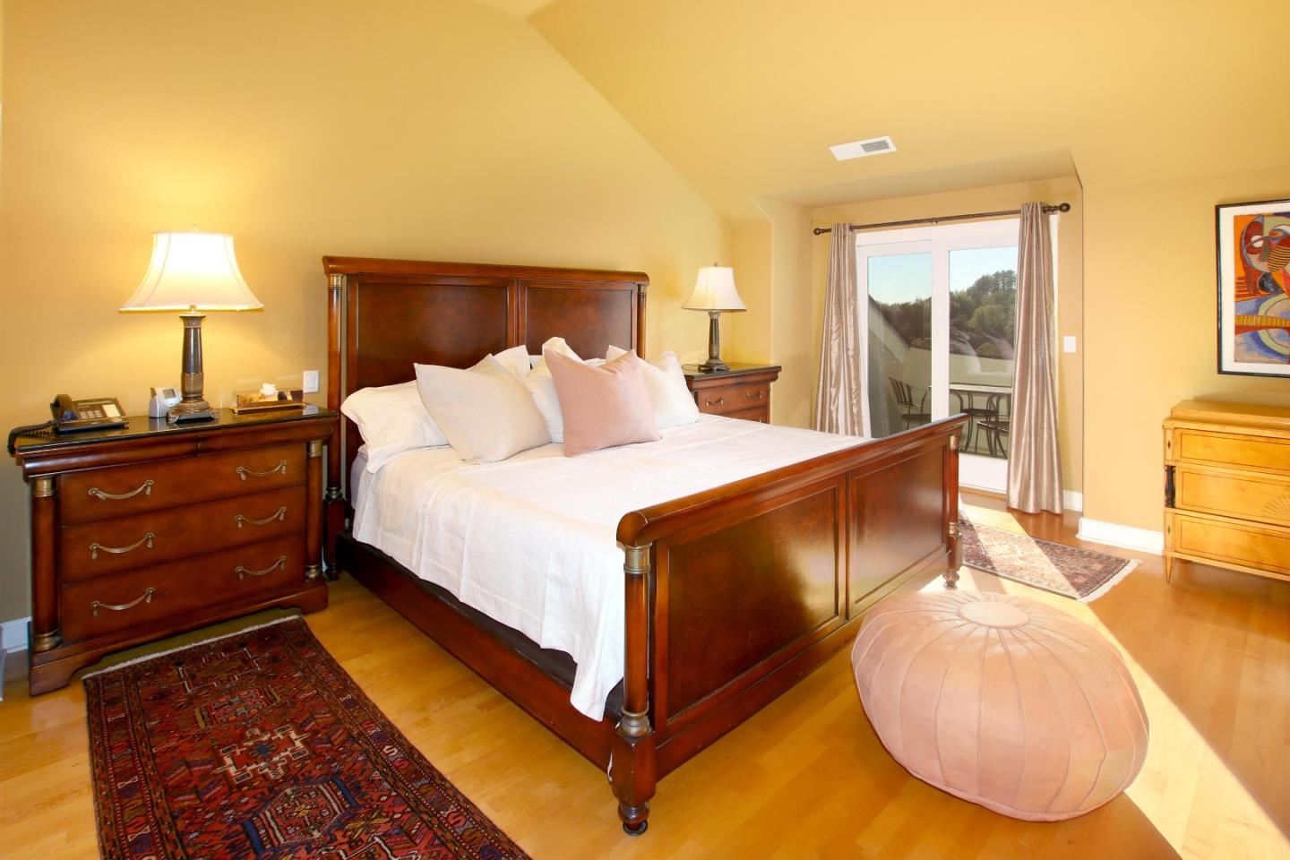 344 Los Robles Road Soquel, CA 95073 - Photo 50 of 76 a bed room with a bed and a lamp