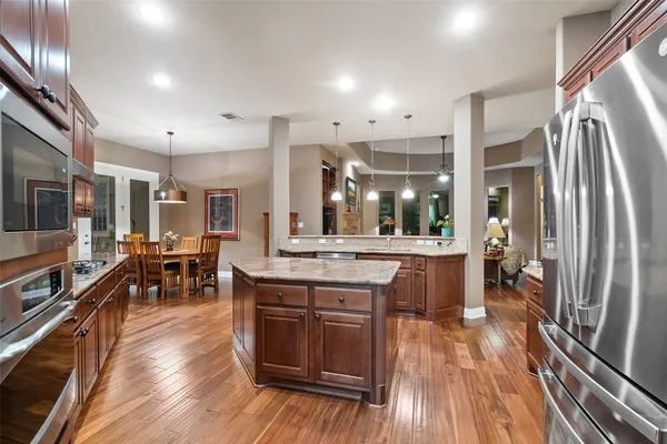 a view of a dining room with furniture and chandelier